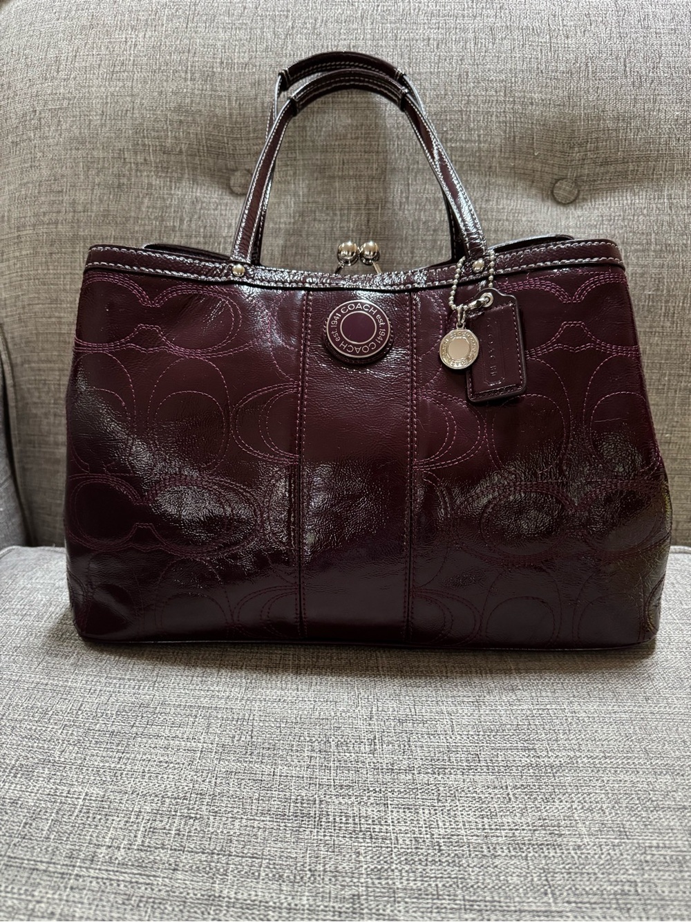 Coach Signature Stitched Patent Leather Kisslock Multi Compartment Carryall Plum